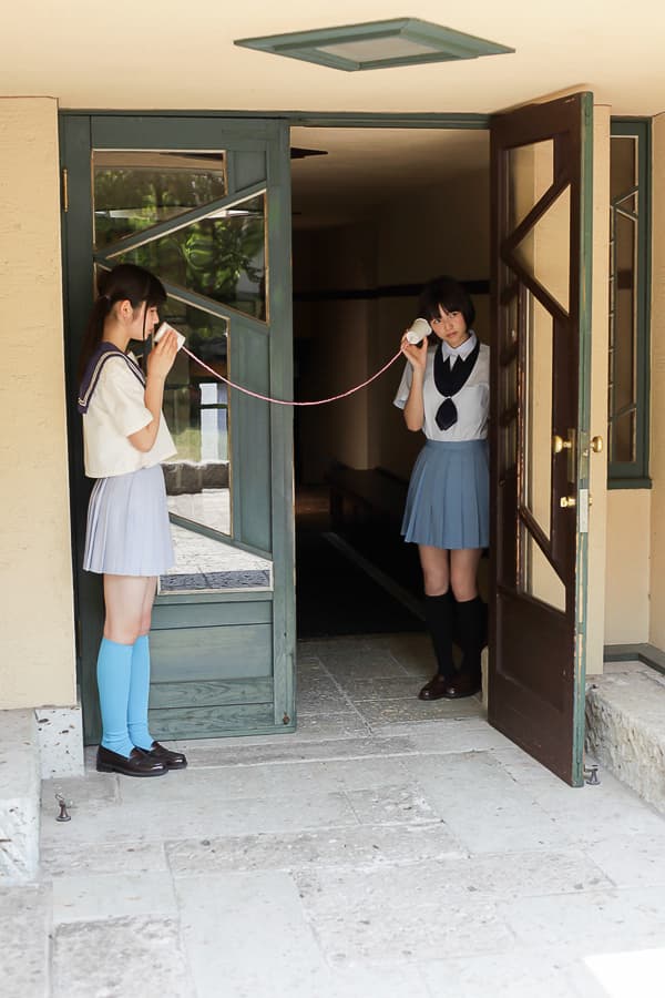 Cotton socks creased around ankles beside bare toes, warm hue and intimate framing